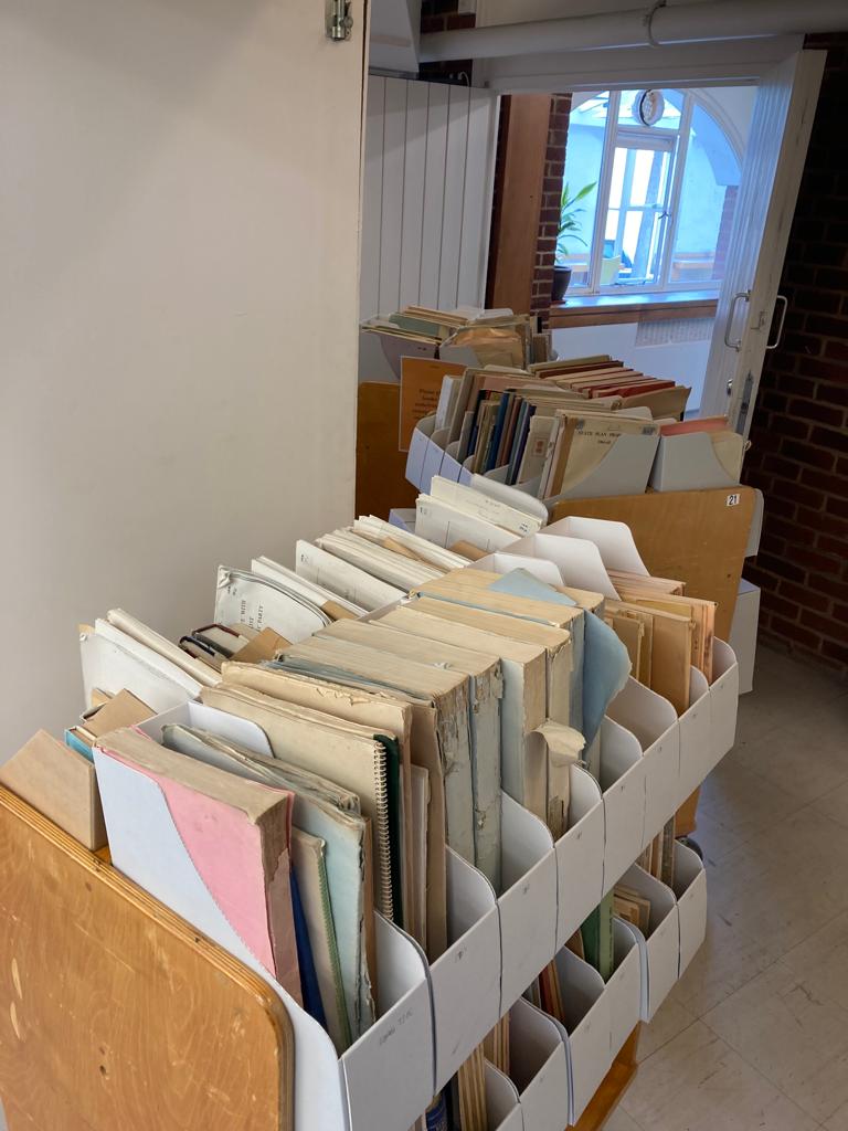 Row of wooden trollies full of BLDS preserved pamphlet boxes