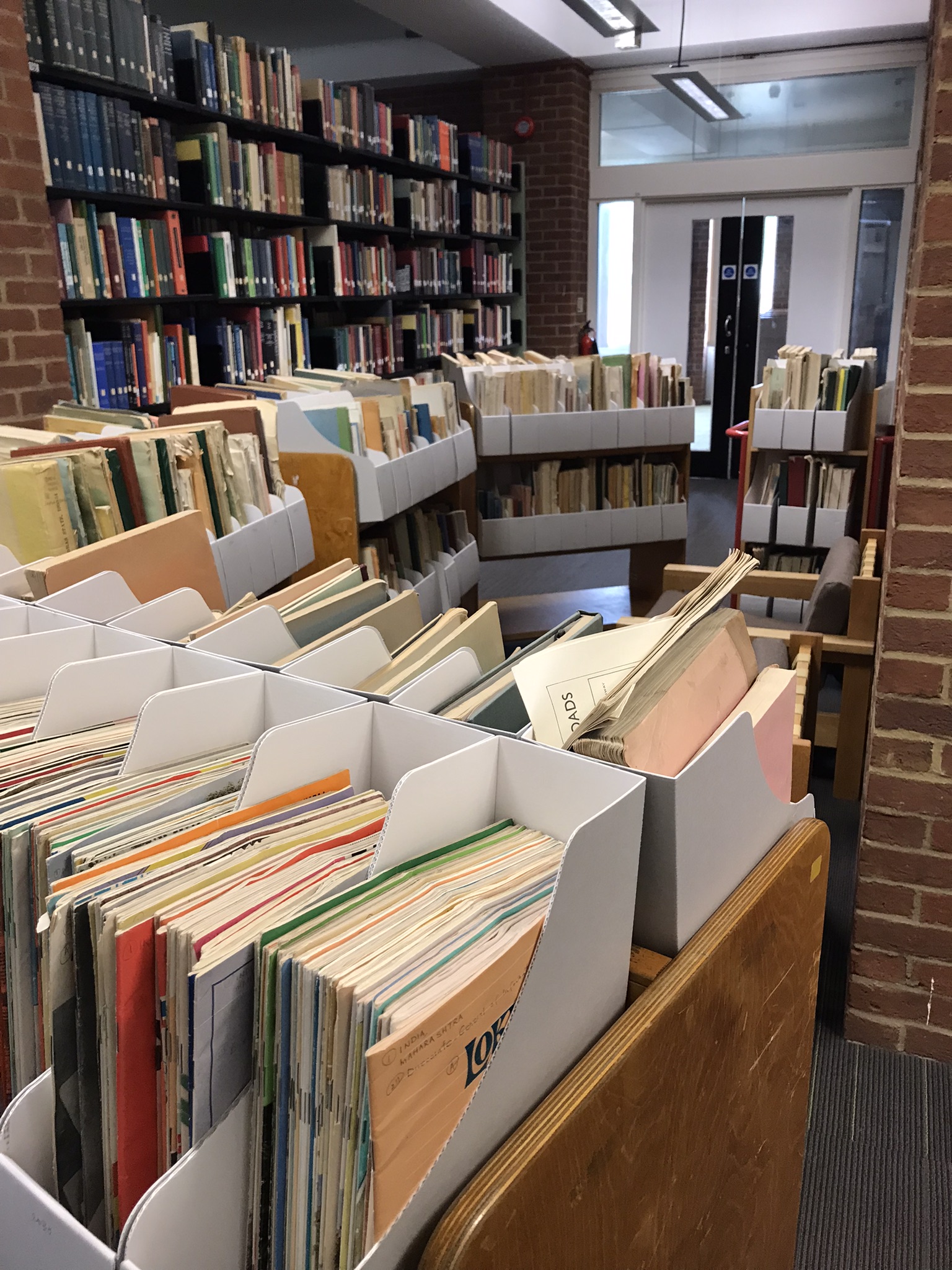 Row of wooden trollies full of BLDS preserved pamphlet boxes